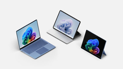 A Sapphire blue Surface Laptop Copilot plus PC, a Surface Laptop Studio 2, and a black Surface Pro Copilot plus PC.