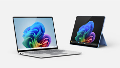 A platinum Surface Laptop and a sapphire Surface Pro.
