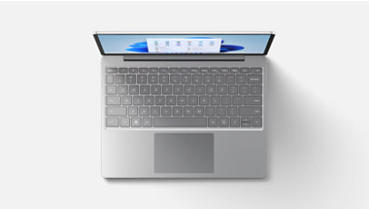 A top-down view of Surface Laptop Go 2 in Ice Blue features the keyboard.