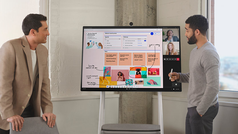 Two men using a Surface Hub 