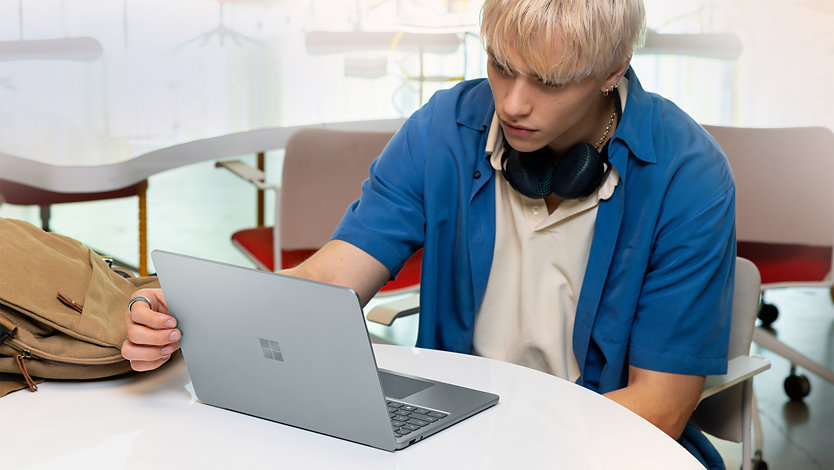 A student working on the 13-inch Ocean Surface Laptop.