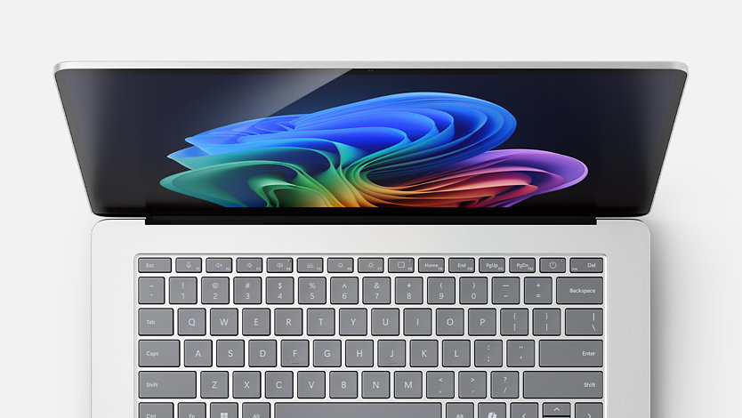 Een bovenaanzicht van een Surface Laptop voor zakelijk gebruik toont de flinterdunne randen. 