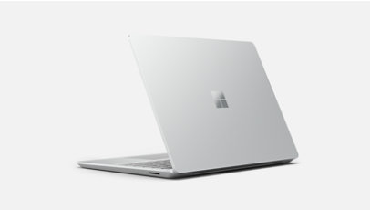A side view of Surface Laptop Go 2 in Sandstone focused on the thinness of the device.