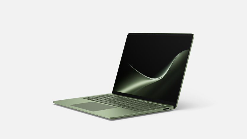 An angled 13.8-inch Surface Laptop, 13.8-inch (8th Edition) in the color Jade. 