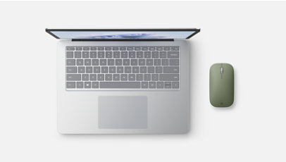 A Surface Laptop Studio 2 and a Microsoft Modern Mobile Mouse. 