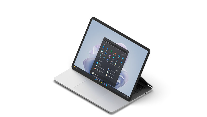 Surface Laptop Studio is shown in stage mode from 3/4 view with the Windows 11 start screen.