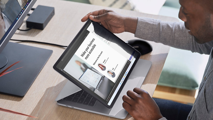 A business owner using a surface devices