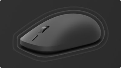 Mysz Surface (2. edycja) otoczona falami reprezentującymi wibracje dotykowe.