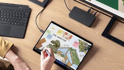 An architect draws on a Surface Pro 10 with a Surface slim pen.