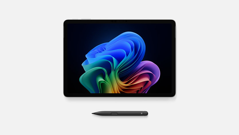 A Surface Pro lies side-by-side with a Surface Slim Pen. 