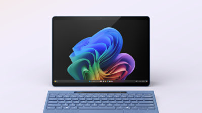 A Sapphire Blue 13-inch Surface Pro with a matching Flex keyboard and black Slim Pen.