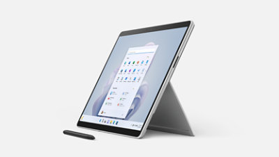 Surface Pro 9 is shown with the kickstand extended and Surface Slim Pen 2 in front from a 3/4 angle.