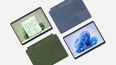 Un Surface Pro 9 con tastiera cover nei colori Forest e Sapphire.