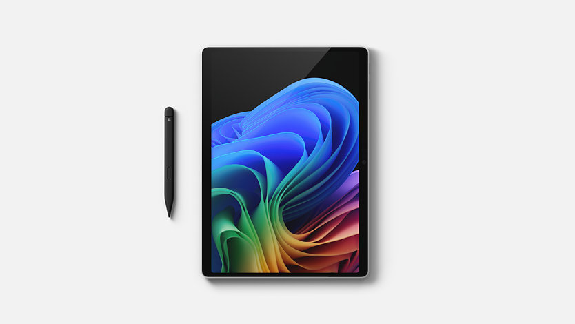 A Surface Pro beside a Surface Slim Pen.