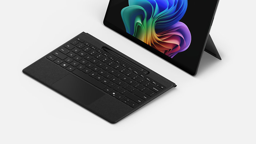 A Surface Pro Flex Keyboard for Business works detached from a Surface Pro for Business.