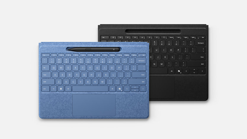 Surface Pro Flex keyboards in Bright Sapphire blue and black colorways. The blue keyboard has a Slim Pen in it's pen storage slot.