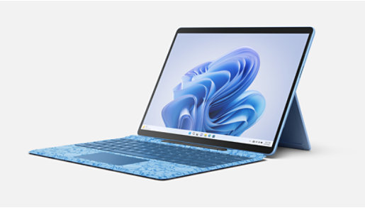 A Surface Pro Liberty Keyboard with Slim Pen 2 charging in slot and a Surface Pro 9