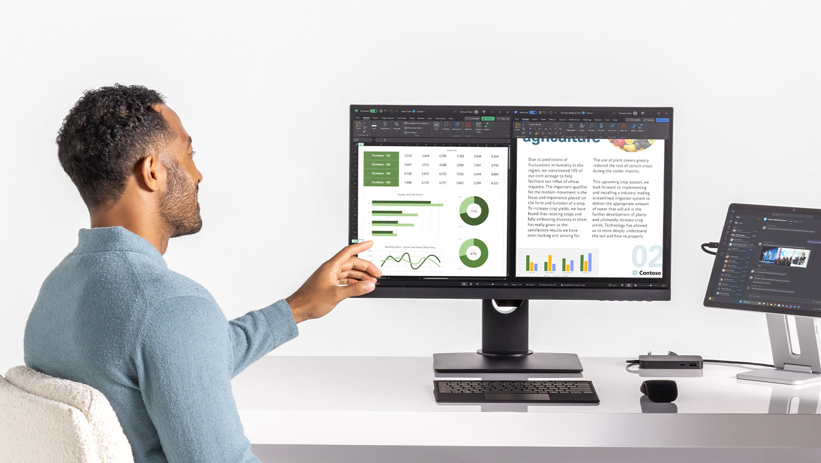 A person works from a desk where they’ve connected an external monitor to a Surface Pro through Surface USB4 Dock for Business. The monitor and device each show different windows open on their screens.