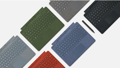 Stylet Slim Pen 2 avec des claviers Signature Surface en différentes couleurs.