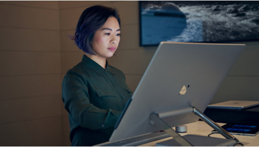 A person using a Surface Studio device