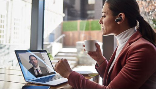 A person taking a call on a Surface device