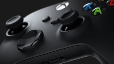 A closeup of the buttons of a black Xbox Wireless Controller.