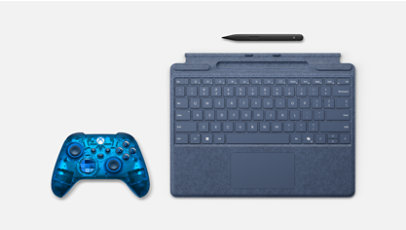A translucent blue Xbox wireless controller, a blue Surface Signature Keyboard, and a Surface Slim Pen.