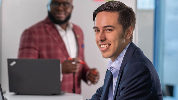 Man looking at the camera directly and smiling