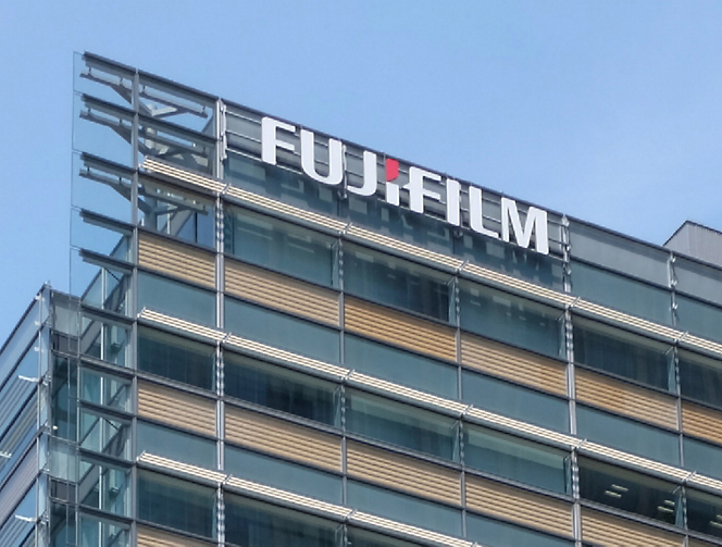 The fujifilm logo is on the side of a building.