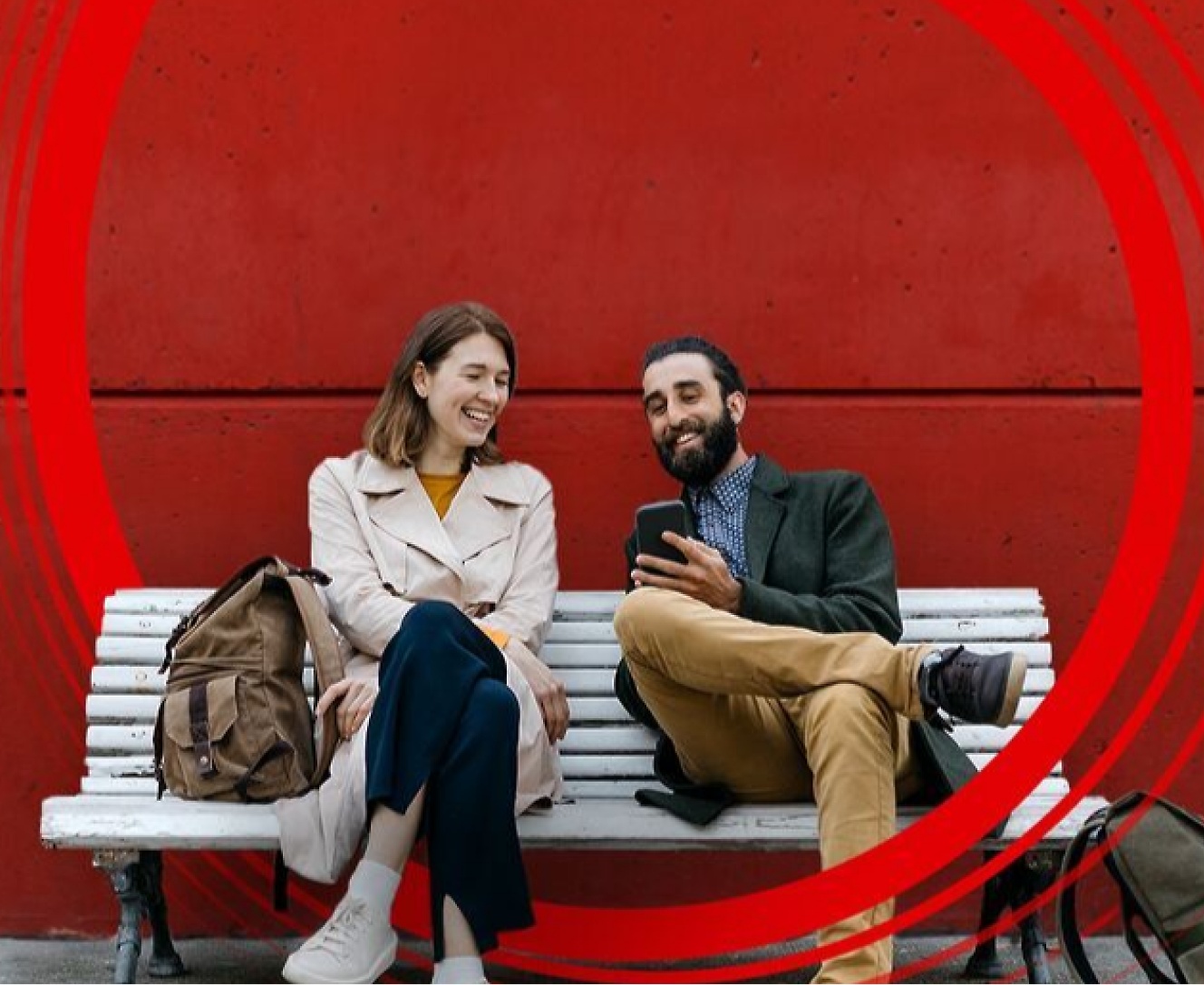 Two persons sitting on a bench and talking