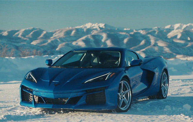 Sports car in snow capped mountains