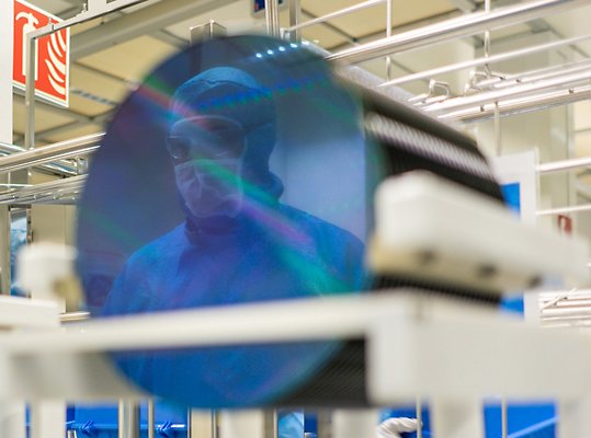 A person wearing HoloLens 2 and using machinery