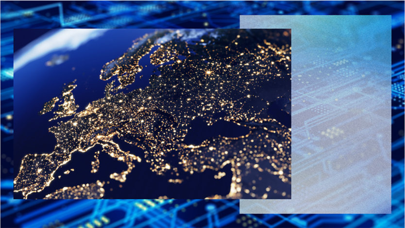 Satellite image of Europe at night. City lights form bright clusters across the continent, highlighting urban areas and transportation networks. The surrounding areas are dark, with coastlines faintly visible.