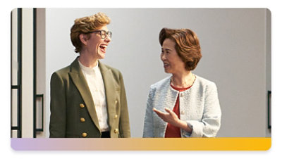 Two colleagues have a walking meeting in a data center