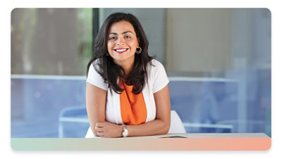 A woman smiling in an office setting