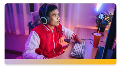 Young man with a disability playing computer games