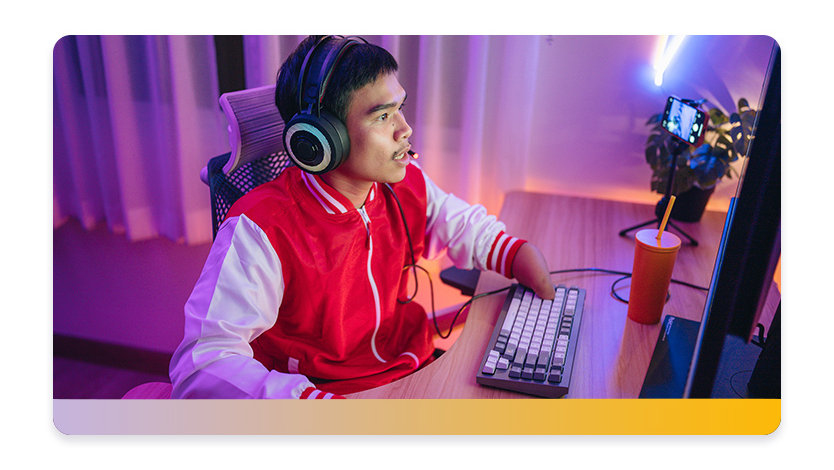 Young man with a disability playing computer games