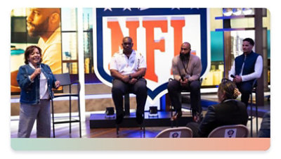 Former NFL players on stage at a Leap event