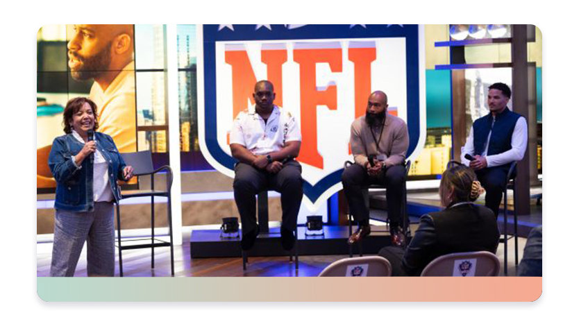 Former NFL players on stage at a Leap event