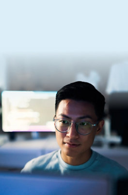A man wearing glasses and looking at the camera.