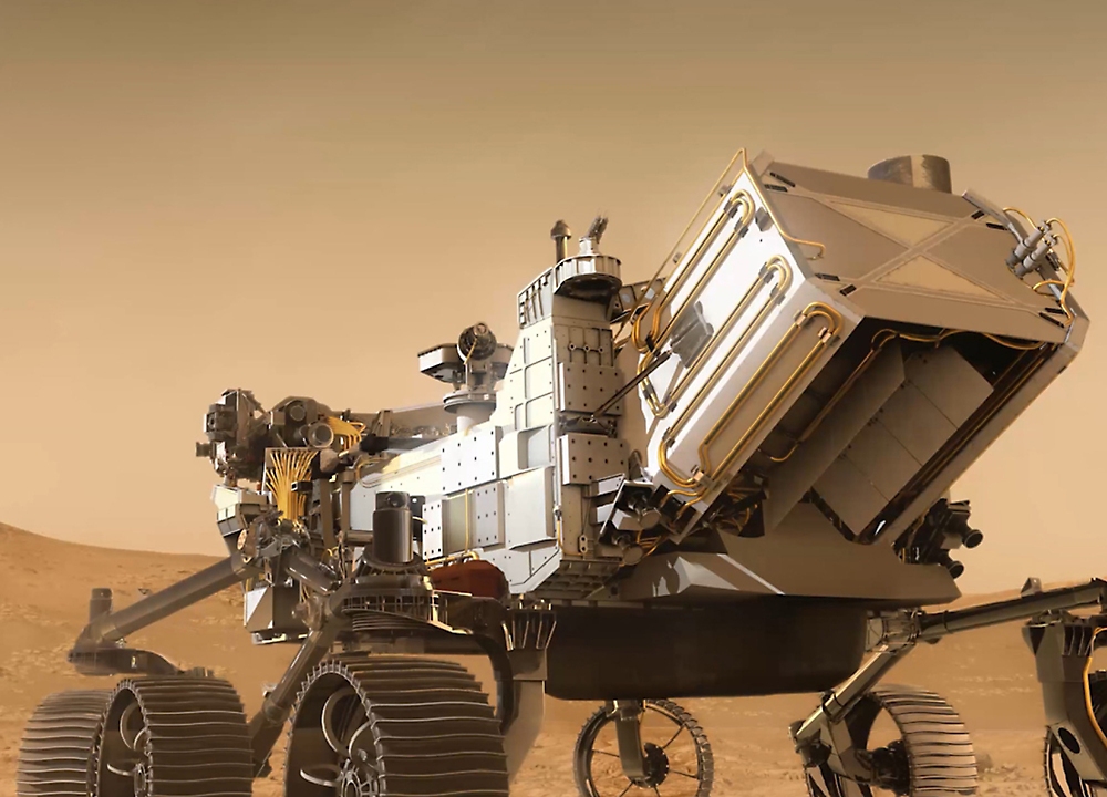 A detailed model of a mars rover with six wheels and complex scientific instruments situated on a simulated martian surface.