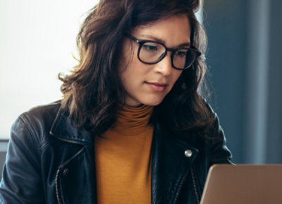 A person looking at a laptop.
