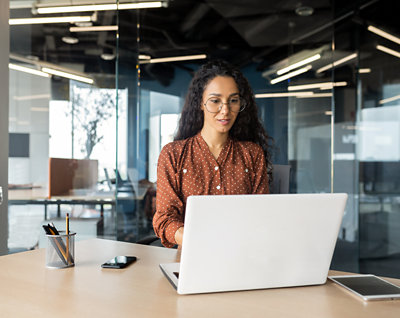 A person sitting at a desk with a computer.