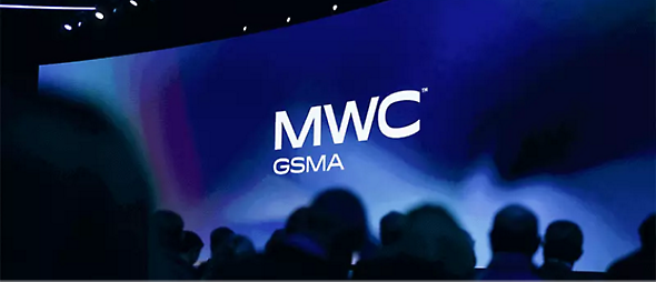 A large screen with MWC GSMA text