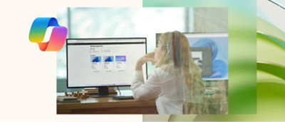 A person sitting at a desk looking at a computer screen
