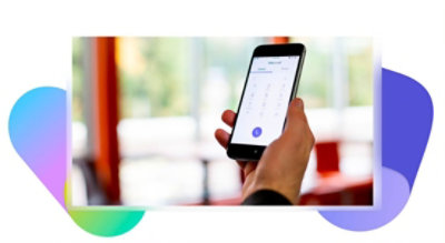 A hand holding a phone on the dial screen in Microsoft Teams