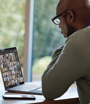 A person using a laptop to participate in a Teams video call.