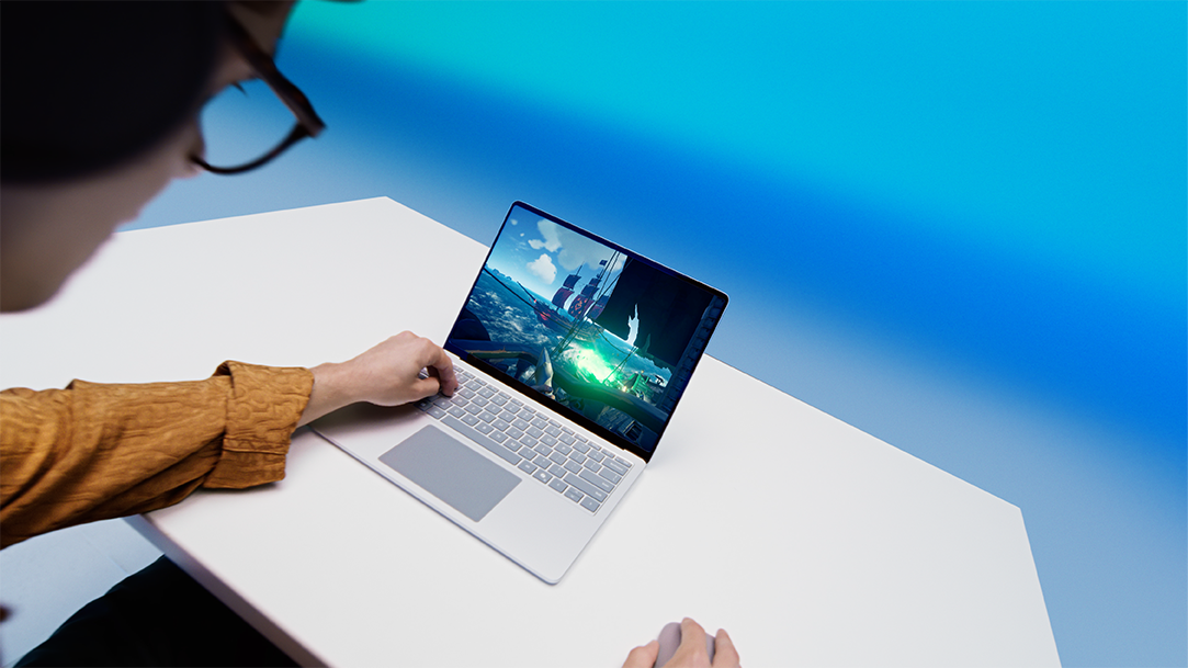 Dylan shows how easy it is to game and multitask on a Copilot+ PC