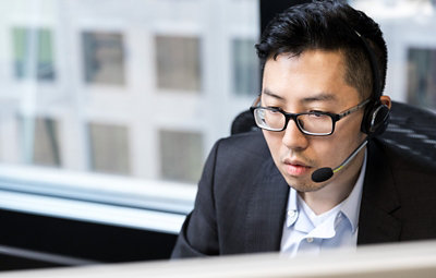 A person working and wearing a headset.