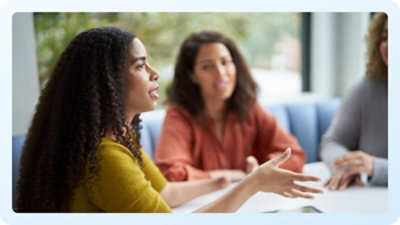 A group of women sitting at a table.